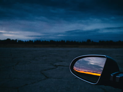 selective focus photography of vehicle wing mirror thumbnail