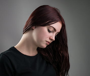 woman in black shirt looking down thumbnail