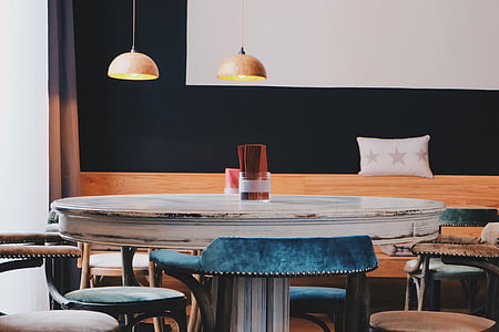 round white wooden pedestal table indoor thumbnail