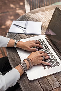 shallow focus photography of person using MacBook Pro thumbnail