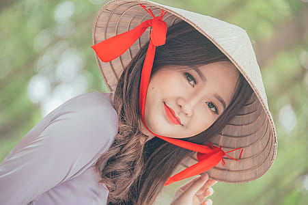 Close-Up Photography of a Woman Wearing Conical Hat thumbnail