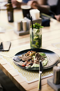 Round Black Plate With Silver Steel Bread Knife thumbnail