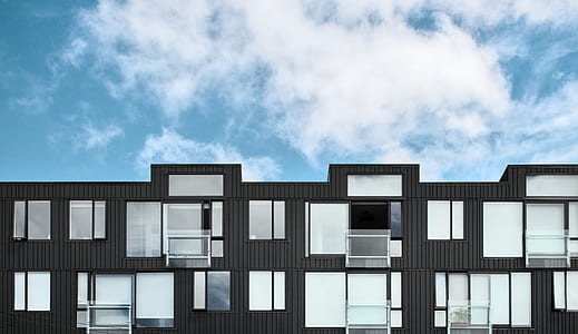 white and black mid-rise building thumbnail