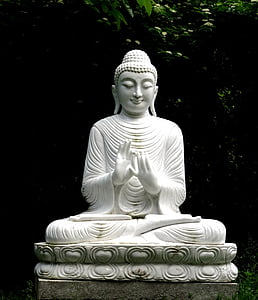 white ceramic buddha figurine thumbnail