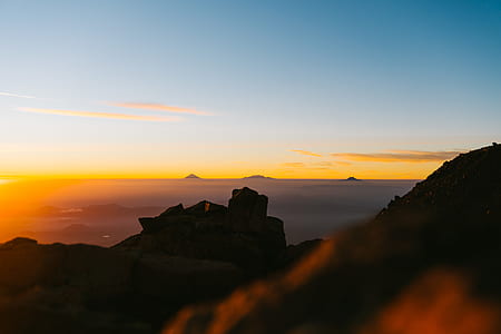 mountain range under blue sky at daytime thumbnail