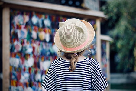 woman wearing beige sun hat thumbnail