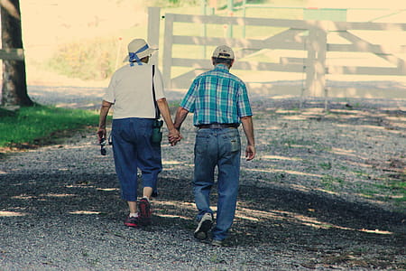 Old Couple Walking While Holding Hands thumbnail