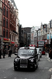 black vehicle on the gray pave road thumbnail