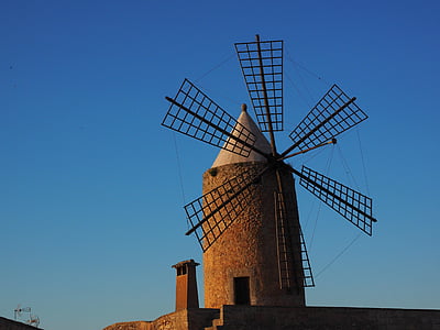 low-angle photo of windmill under clear blue sky thumbnail