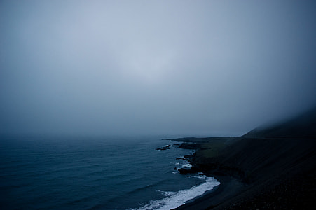 mountain beside ocean thumbnail