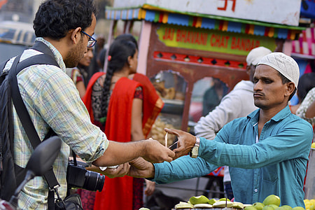 man buying fruit in market thumbnail