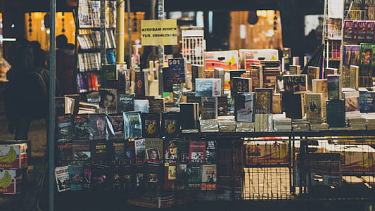 pile of books and boxes on top of table thumbnail