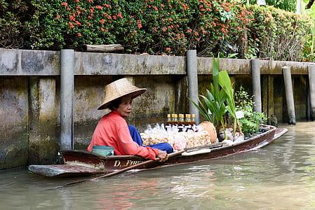 woman on brown paddle boat thumbnail