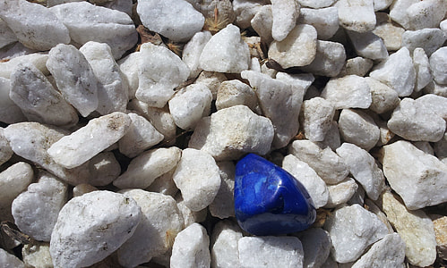 selective focus photography of blue stone thumbnail