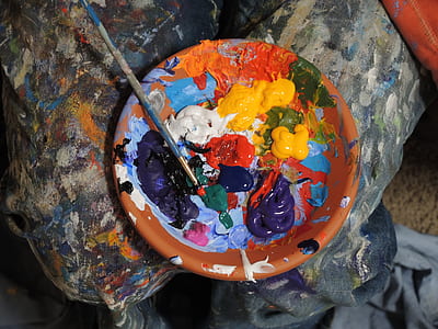 assorted-color paint on orange bowl with paint brush thumbnail