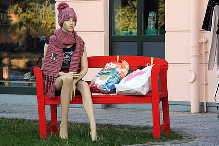 female mannequin on red bench thumbnail