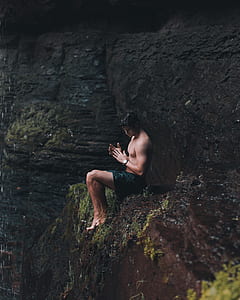 man sitting on brown mountain thumbnail