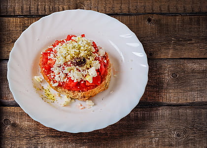 Pastry With Cream in Ceramic Saucer thumbnail