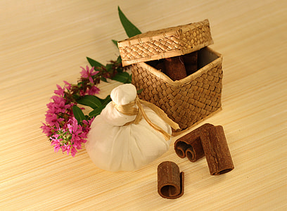 pink flowers beside brown woven basket thumbnail