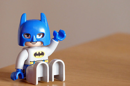 Batman Lego action figure on brown wooden table thumbnail