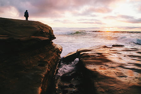person standing on seacliff thumbnail
