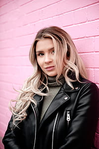 Woman Portrait On Pink Brick Photo thumbnail