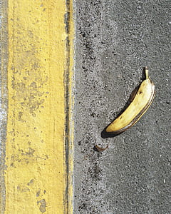 ripe banana on gray asphalt road during daytime thumbnail