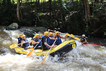 group of men riding on inflatable boat sailing on river thumbnail