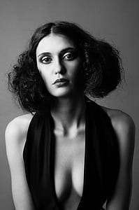 grayscale photography of woman wearing deep v-neck halter top thumbnail