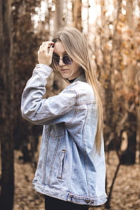 woman wearing blue denim jacket and sunglasses thumbnail