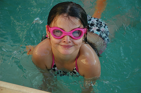 girl wearing swimsuit with goggles on swimming pool thumbnail
