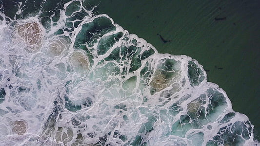 aerial photography of ocean waves thumbnail