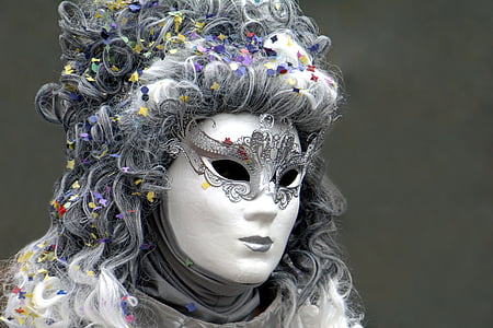 photo of person in white and gray mask and gray top thumbnail
