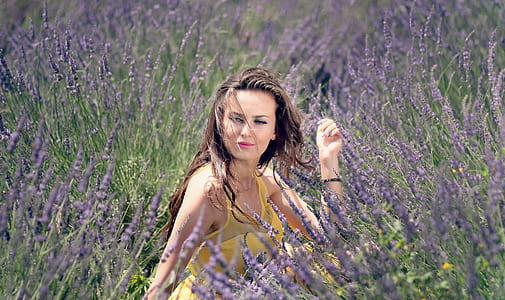 woman standing on grass field thumbnail