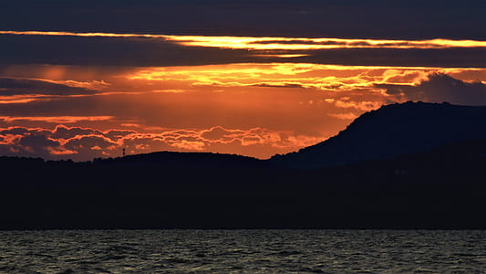 silhouette of mountain during golden hour thumbnail