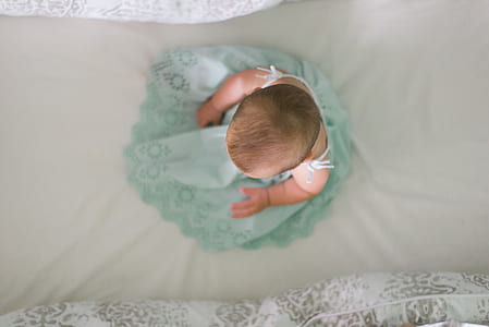 toddler wearing green floral dress thumbnail