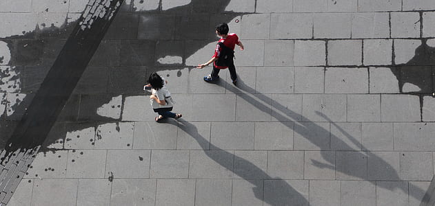 high angle photo of man and woman walking thumbnail