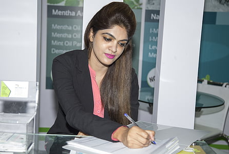 woman in black blazer writing on white paper thumbnail