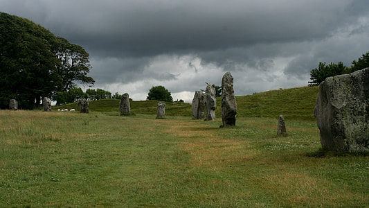 rocks lined up on grass field thumbnail