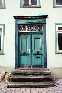 teal wooden closed door at daytime thumbnail
