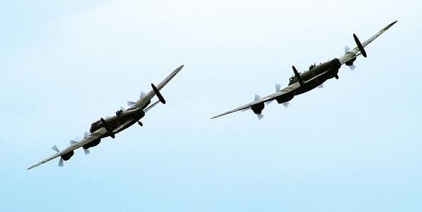 two gray-and-black planes on sky thumbnail