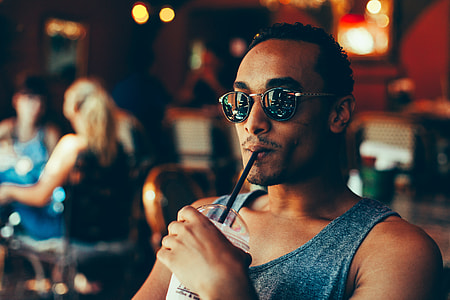 closeup photo of person sitting drinking thumbnail