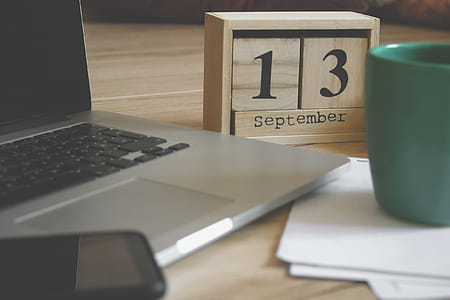 Brown Wooden Block Desk Calendar Displaying September 13 thumbnail