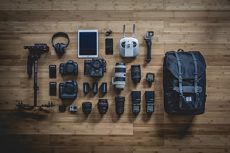 black and gray camera set on wooden surface thumbnail