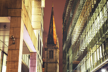 Church spire surrounded by modern buildings in London thumbnail