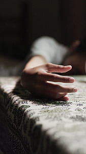 person putting his hands on table thumbnail