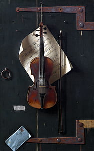 violin with bow hanged on wall thumbnail