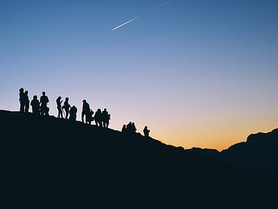 group of people on top of mountain thumbnail