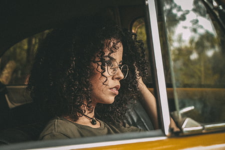 woman inside vehicle on selective focus photography thumbnail