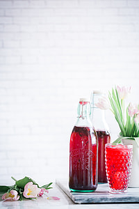clear glass bottle on white surface thumbnail